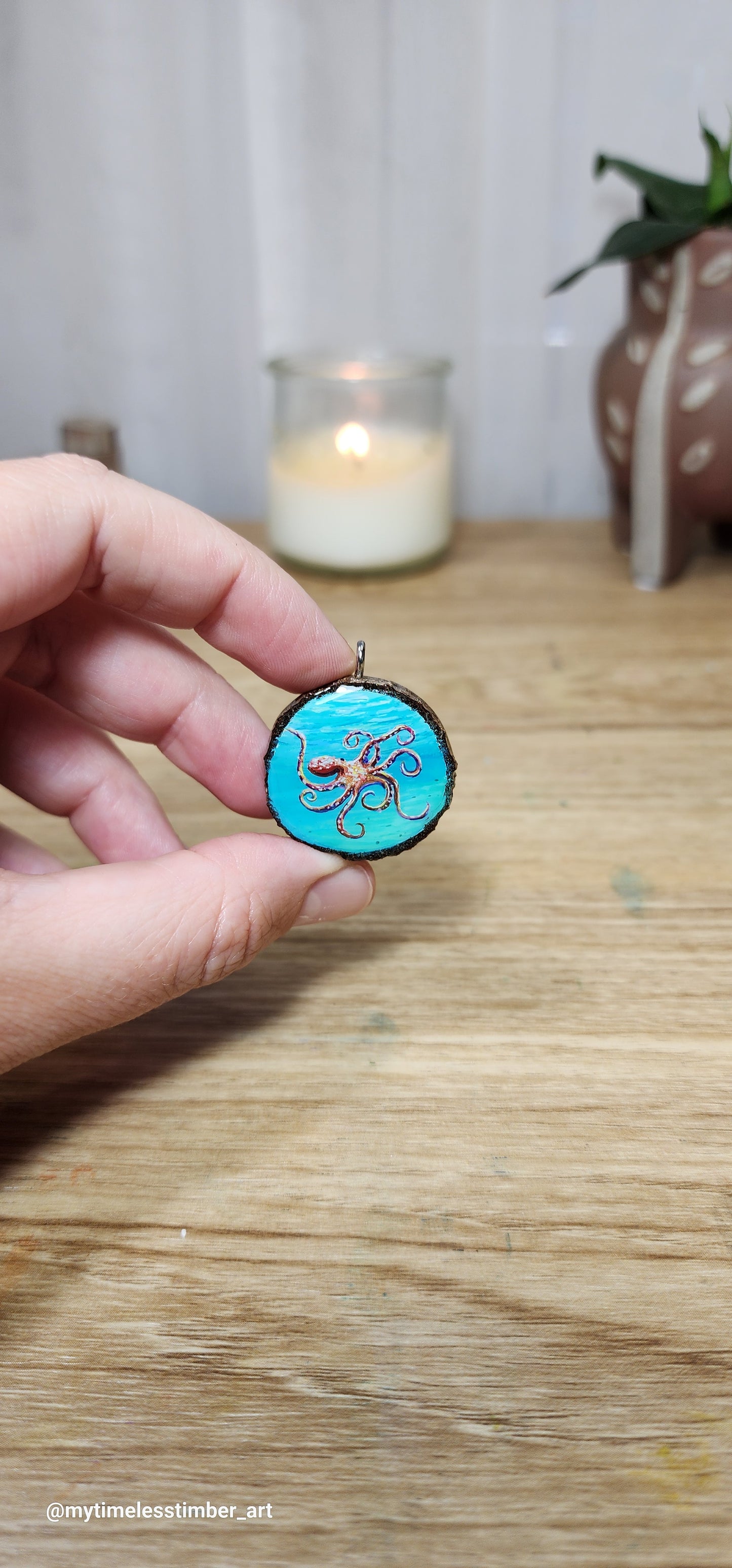 "Octopus Drifts in Teal Waters"
